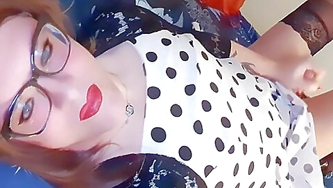 Sexy red-haired blonde is wearing stockings and lingerie