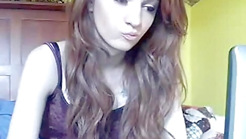 Beautiful girl in a white dress and sweater taking off