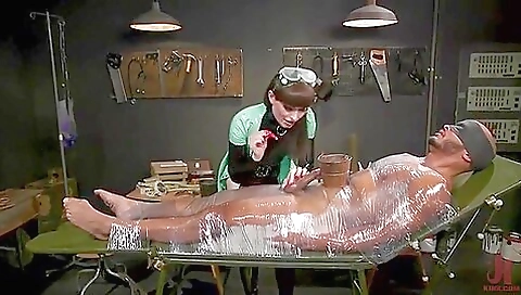 Two shemale women with latex and strapon dominate each other